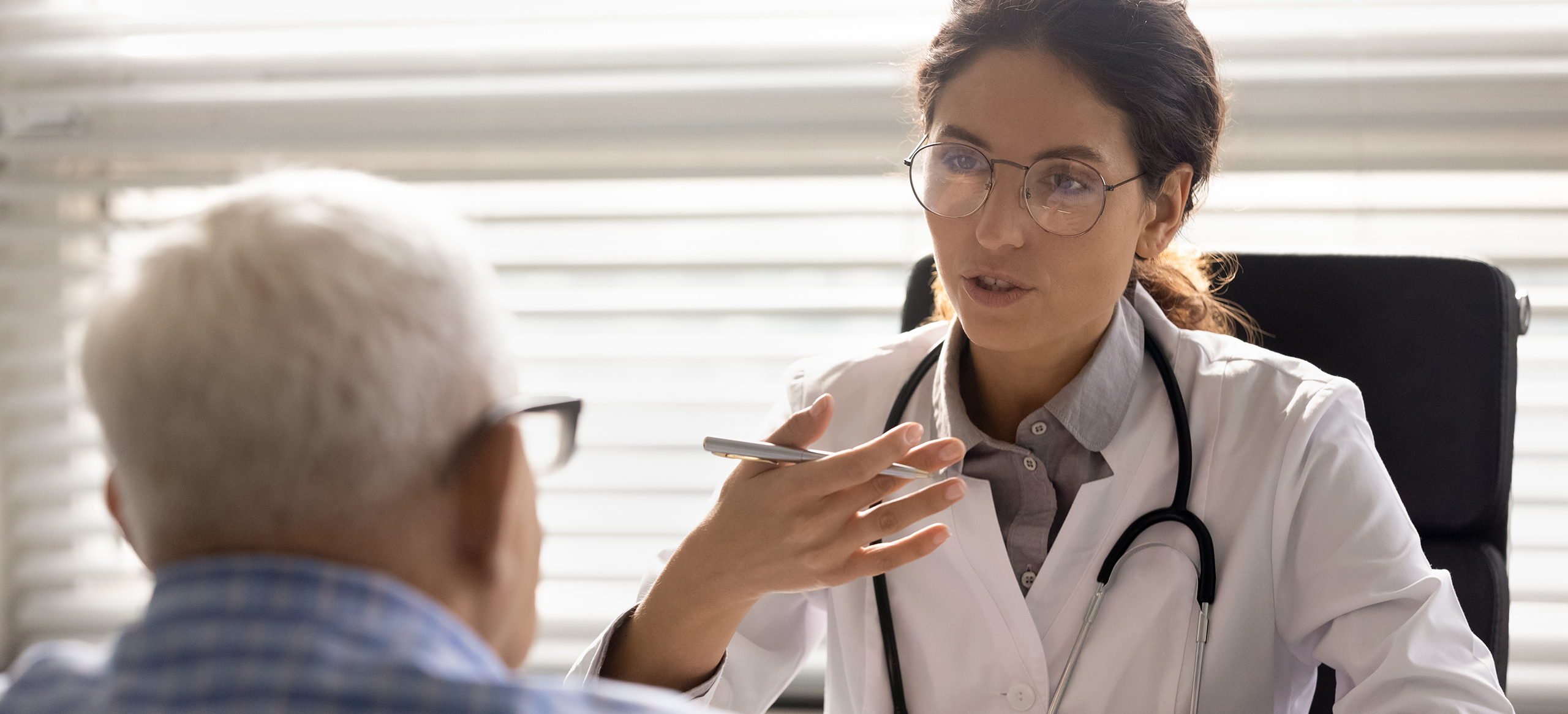 Doctor talking to patient about health report